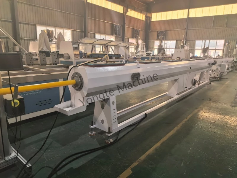 why are both the vacuum tank and the spray tank essential in PE pipe extrusion line?